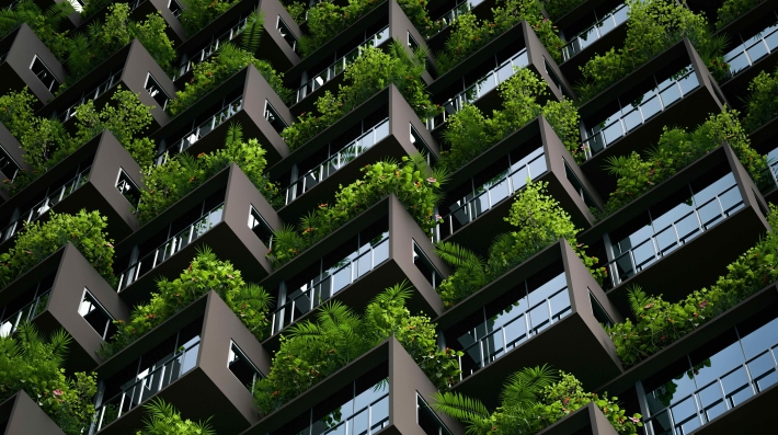 Tall building with windows and greenery