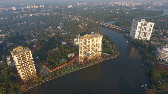 An aerial view of buildings and a canal 