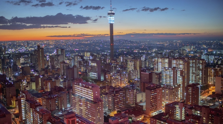 An aerial view of a city at twilight.