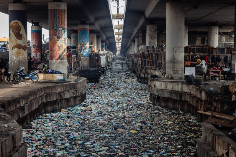 A view of a clogged up canal filled with styrofoam and single use plastic at Obalende in Lagos on 23 January 2024.