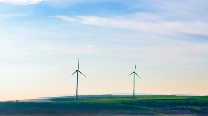  Windmills in a grass field.