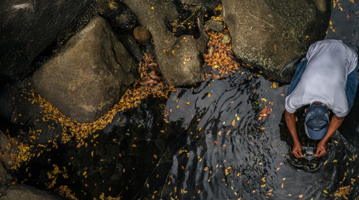 Man tests water quality in Comoros